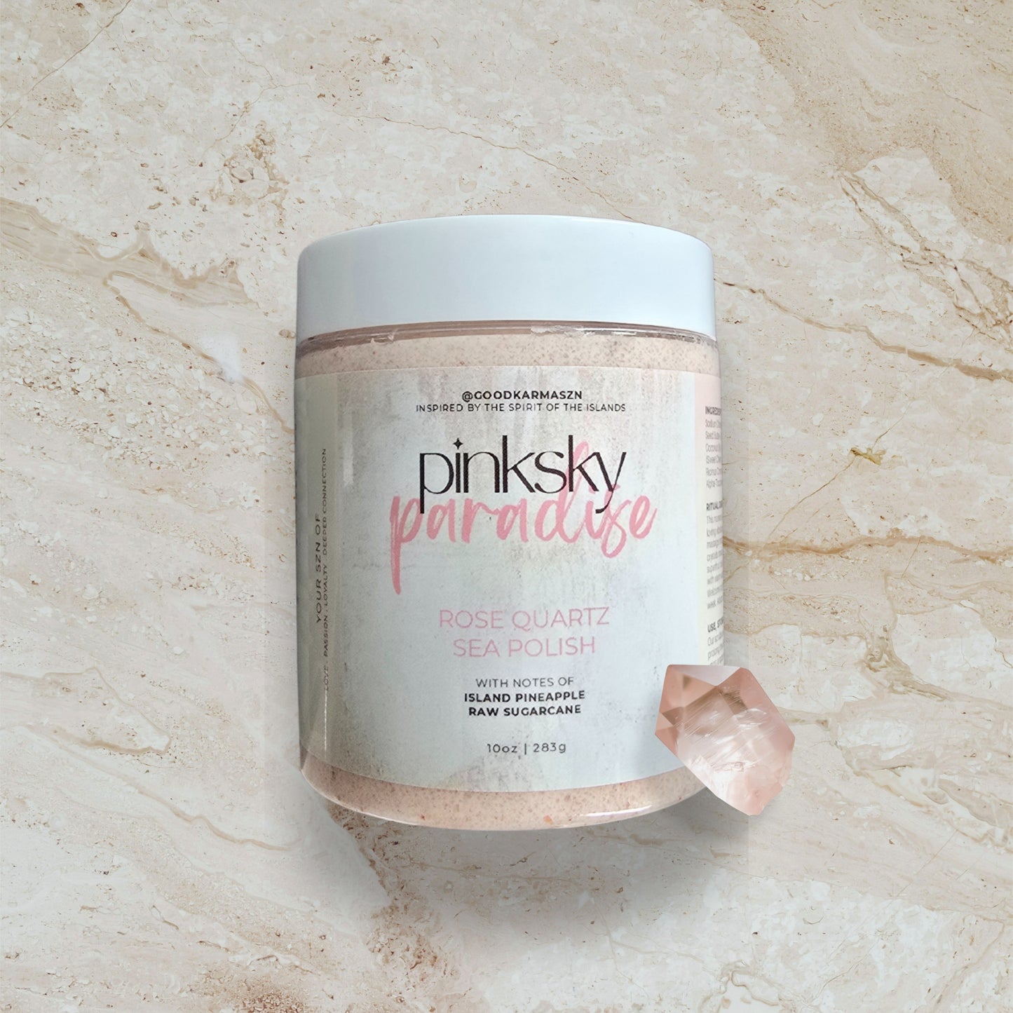 Jar of pinksky paradise rose quartz sea polish on a marble surface