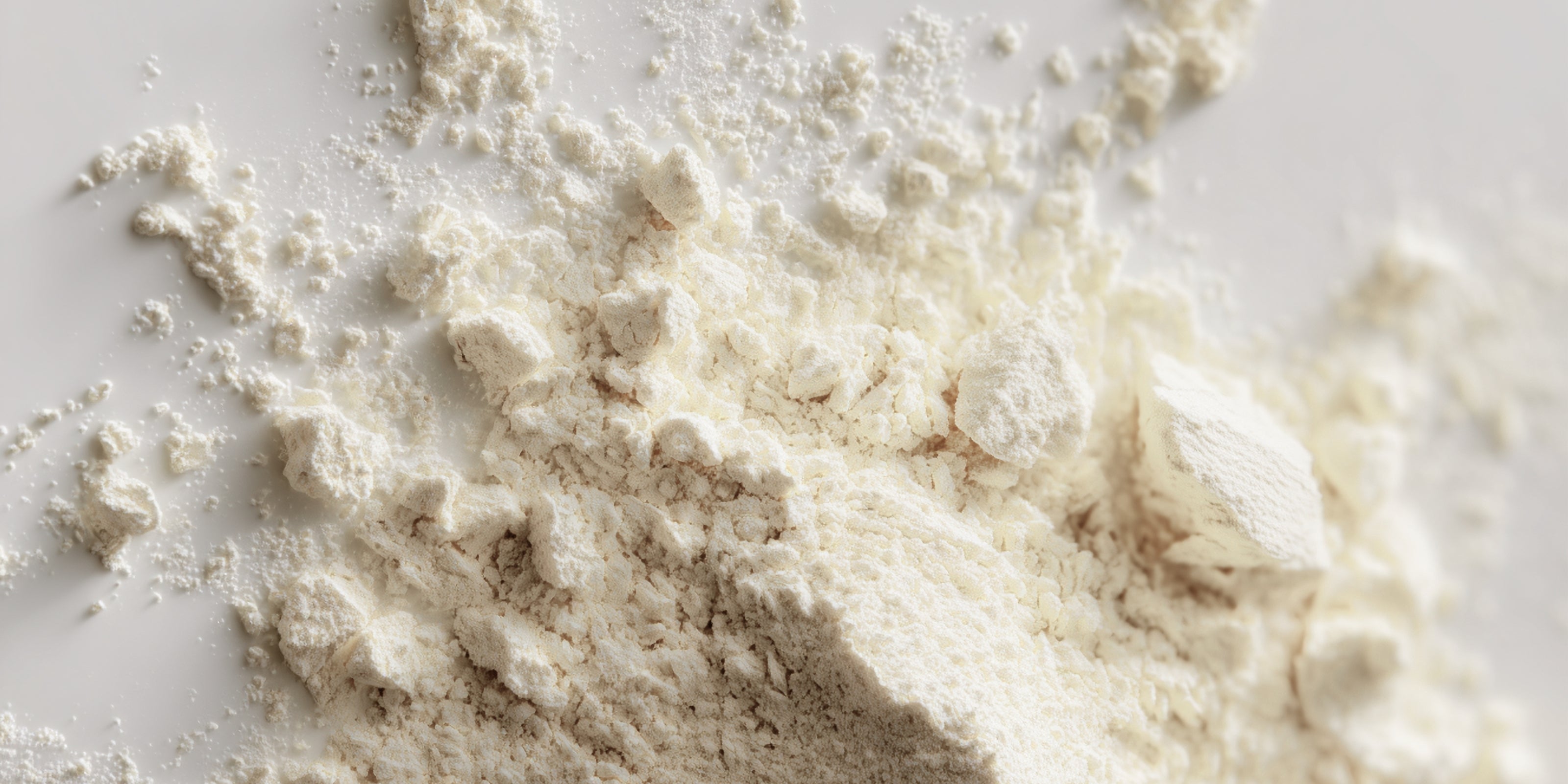 Close-up of oat flour on a white surface
