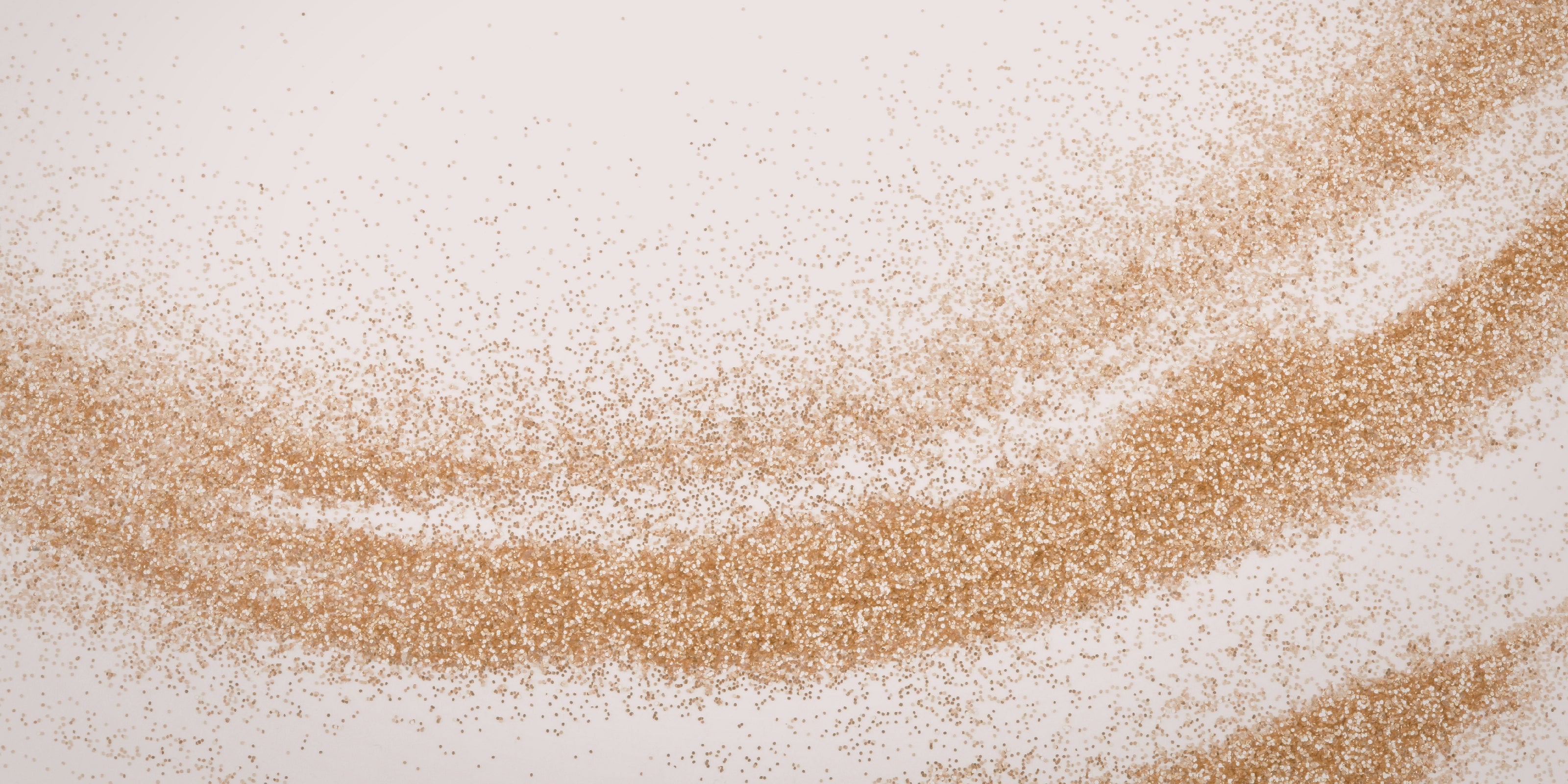 Close-up of gold shimmer on a light background