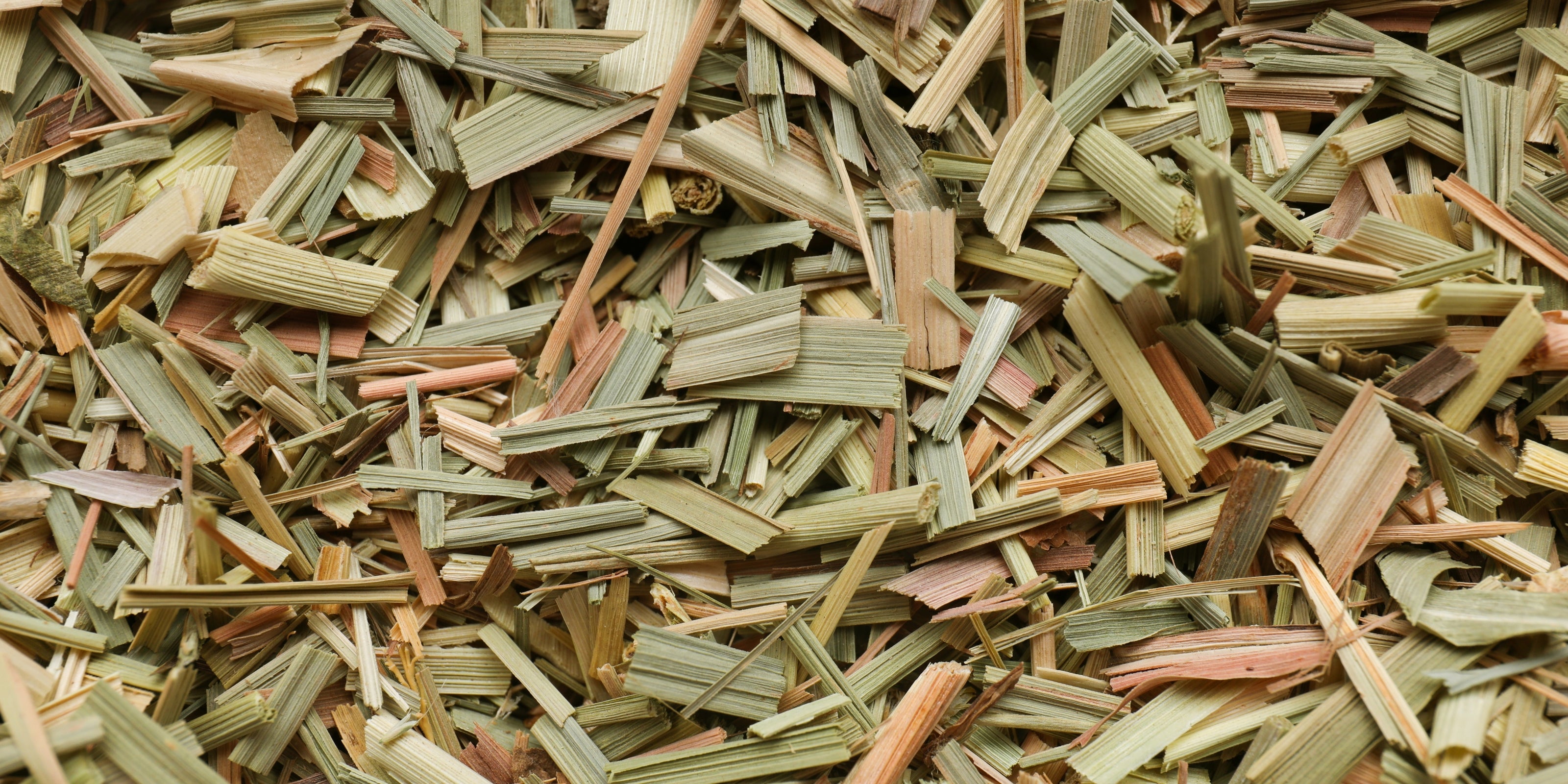 Close-up of dried lemongrass herbs in various shades of green and brown.