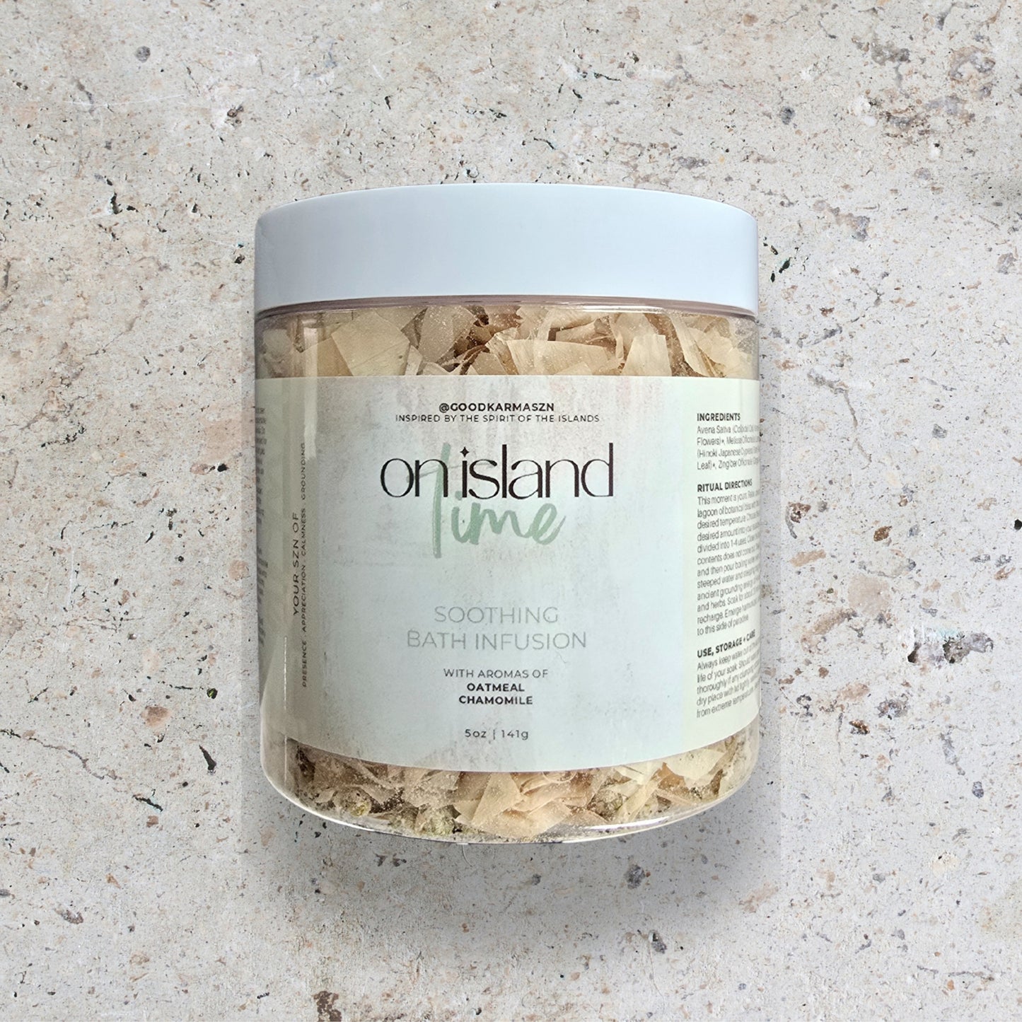 Jar of 'On Island Time' soothing bath infusion on a textured surface