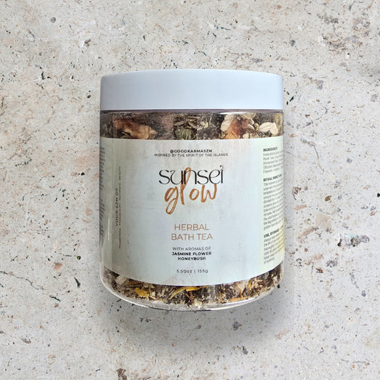 Jar of 'Sunset Glow' herbal bath tea on a textured surface