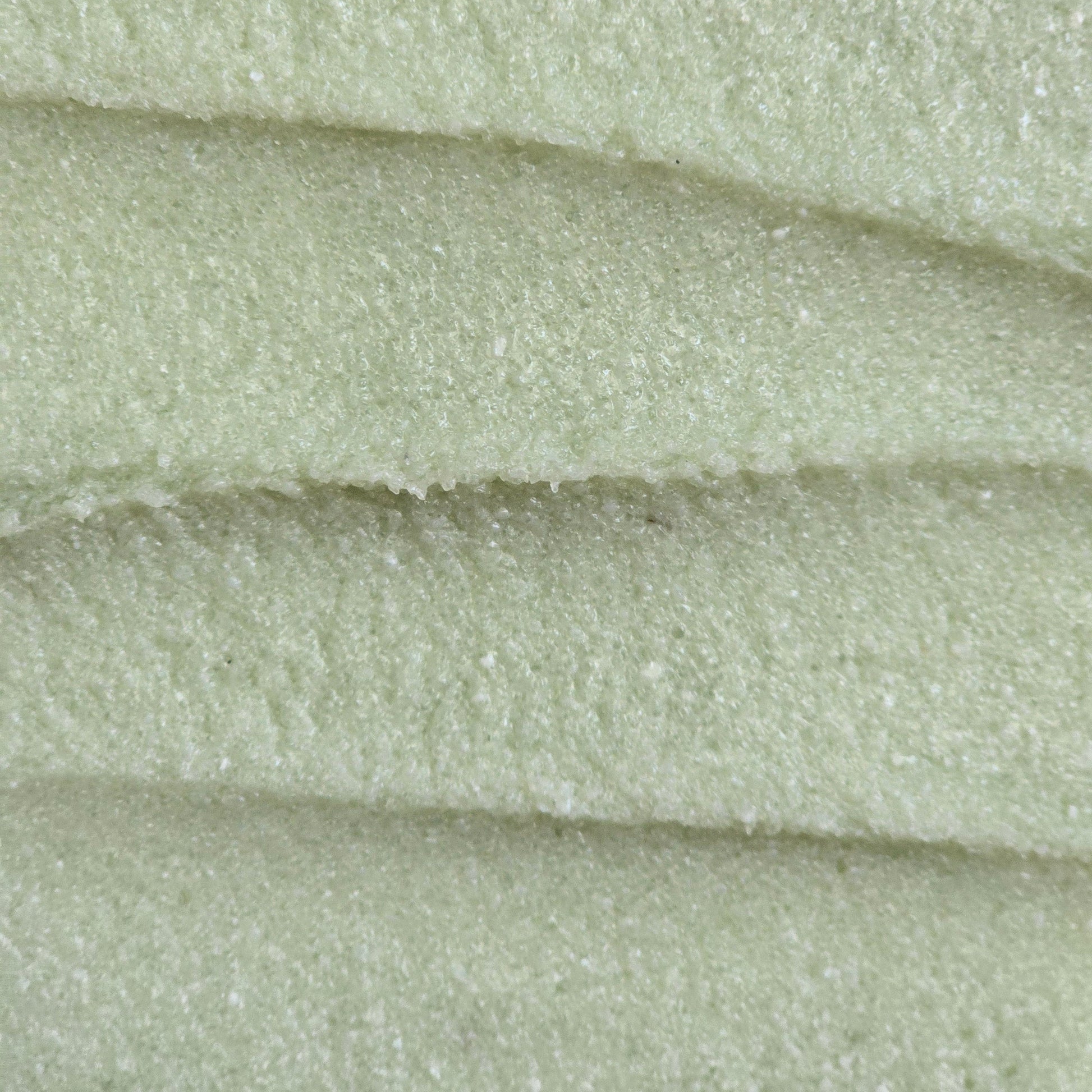 Close up of light green whipped sugar scrub texture 
