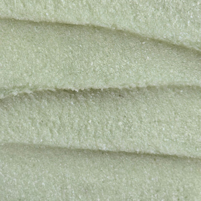 Close up of light green whipped sugar scrub texture 
