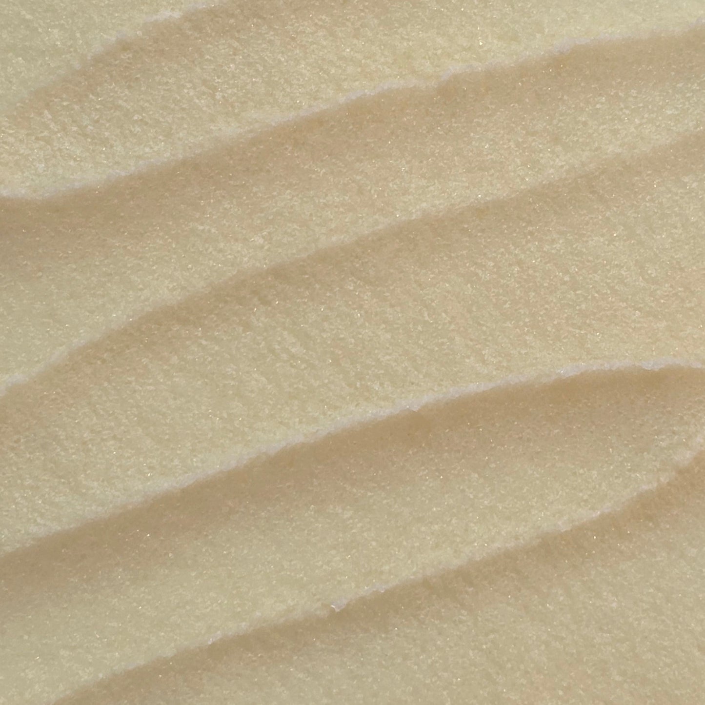 Close up of whipped light yellow sugar scrub texture