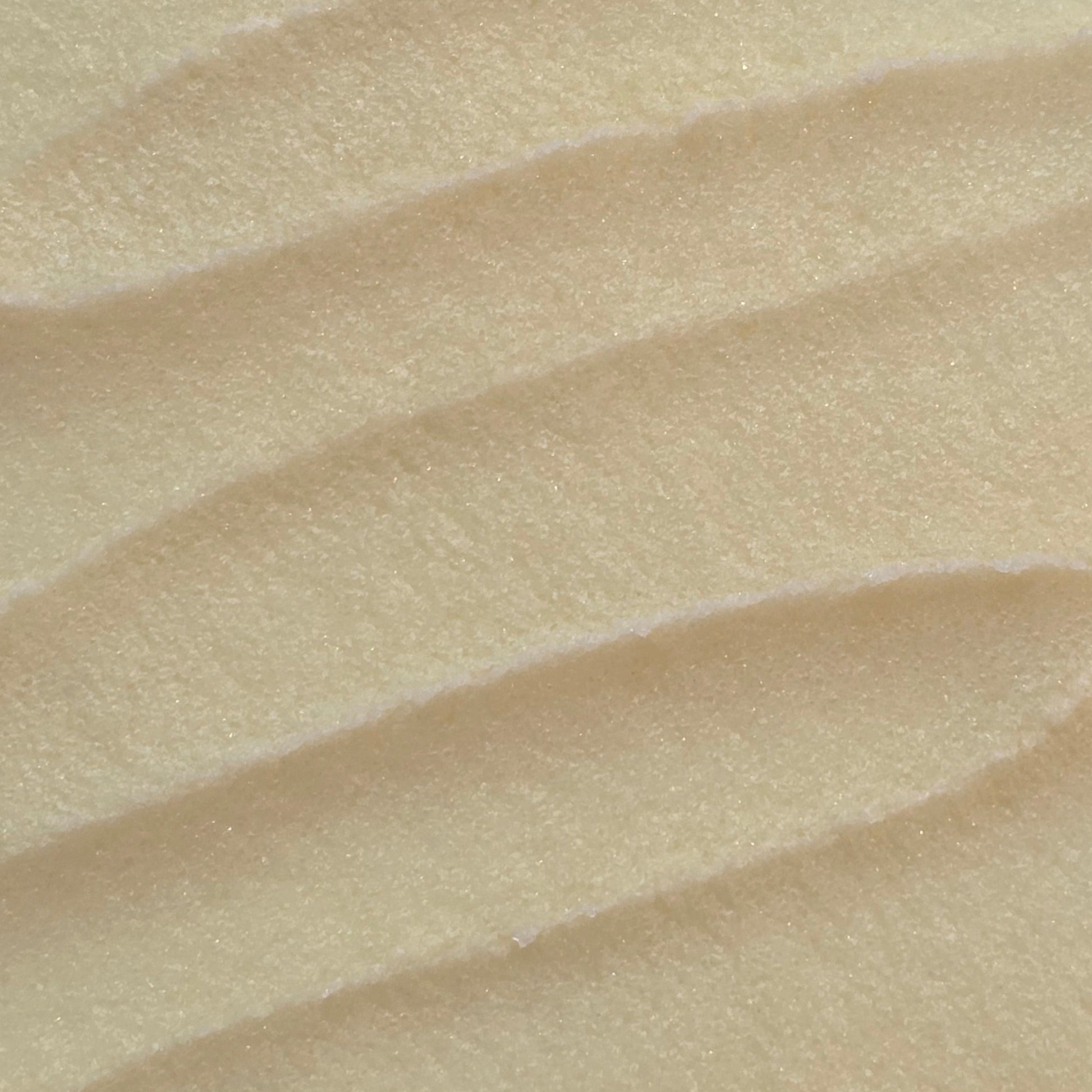 Close up of whipped light yellow sugar scrub texture