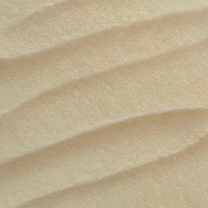 Close up of whipped light yellow sugar scrub texture