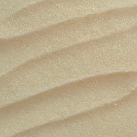 Close up of whipped light yellow sugar scrub texture