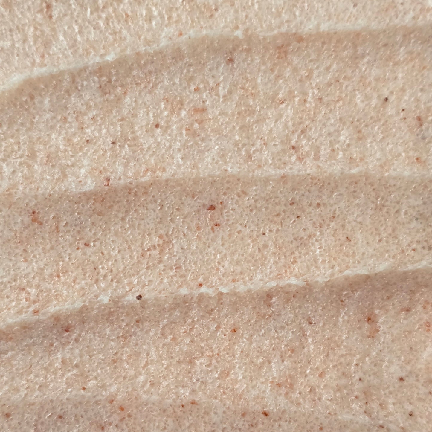 Close up of whipped pink sea salt scrub texture