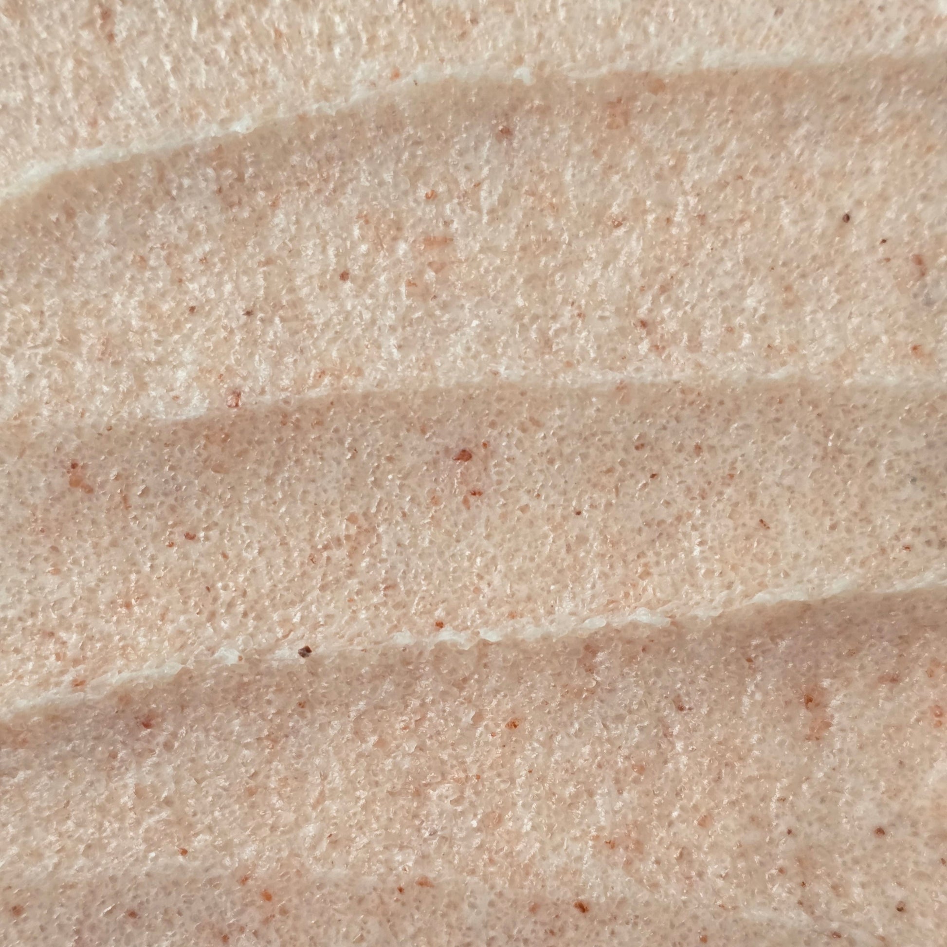 Close up of whipped pink sea salt scrub texture